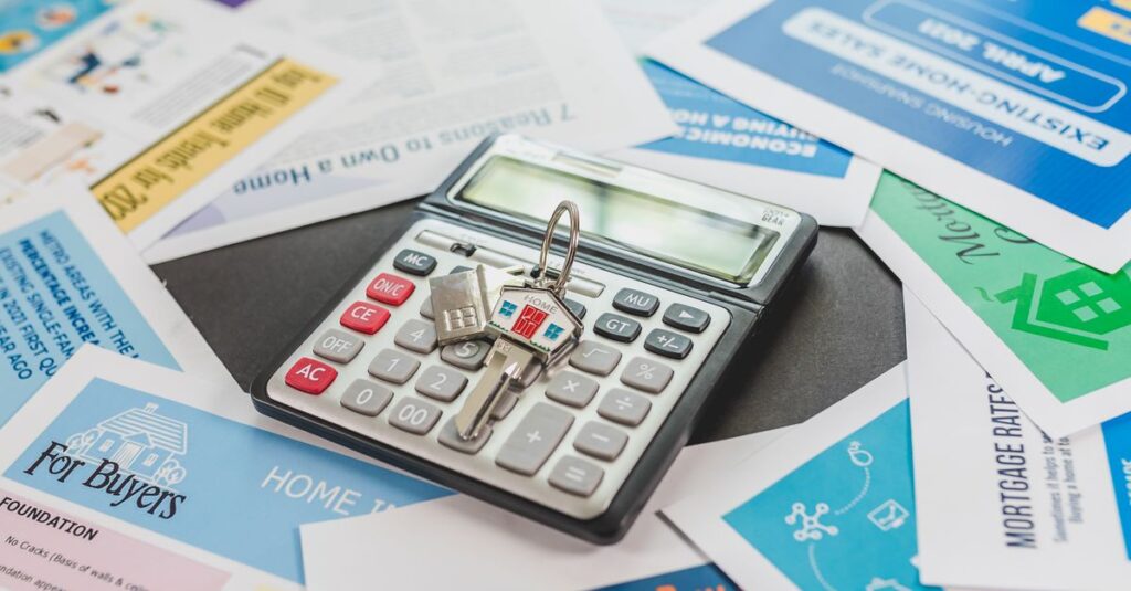 A calculator and real estate flyers depicting financial planning for home buyers.